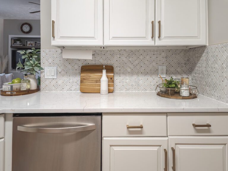 cream kitchen cabinets with backsplash